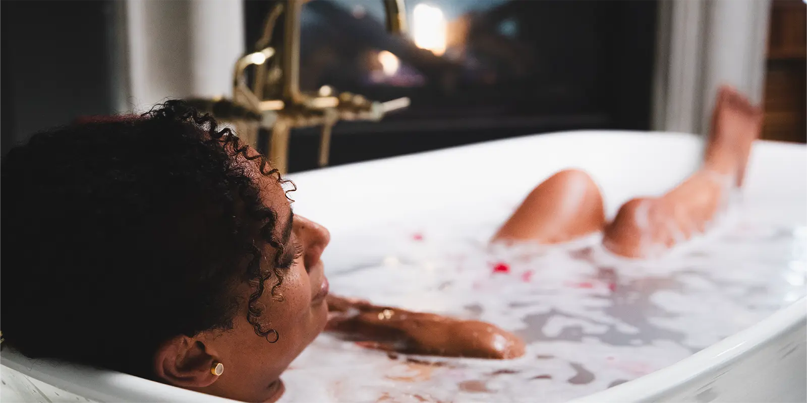 Woman relaxing in a milky blue Bathorium bath